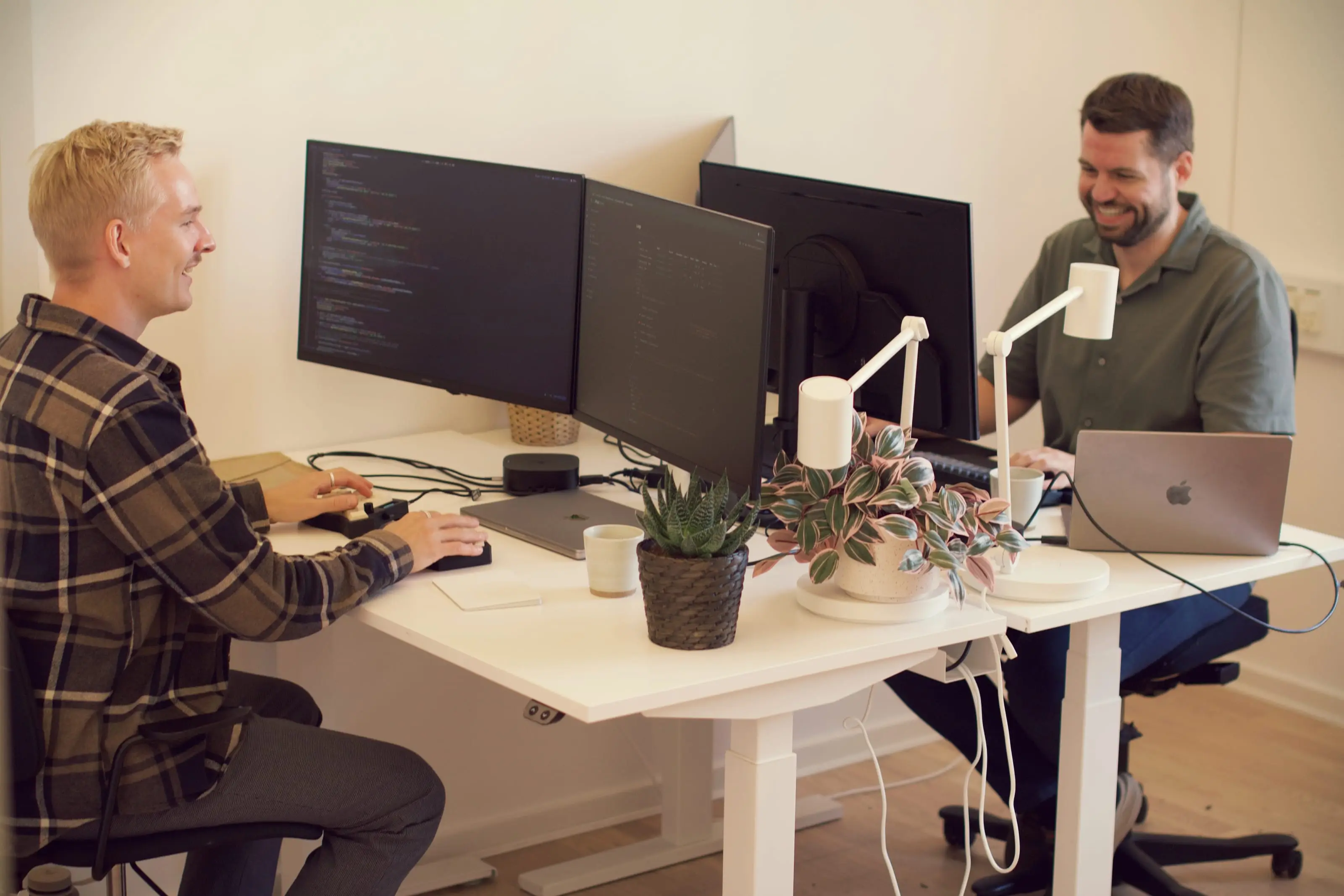 Two of the PineGrove founders working at their desks
